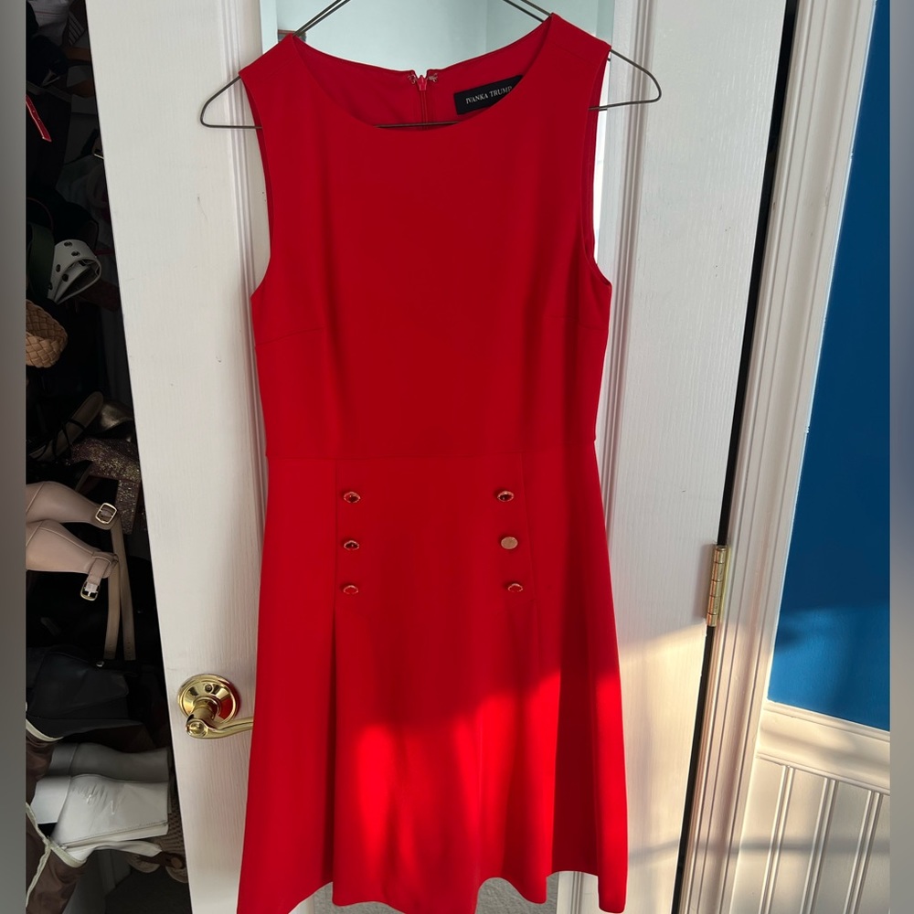 Red Ivanka Trump dress with gold buttons
